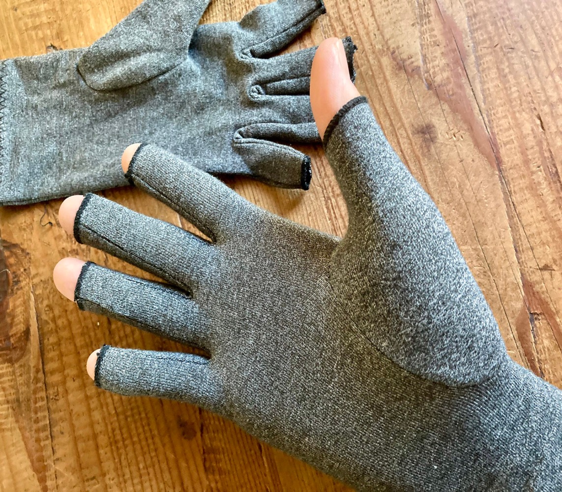I found compression gloves for injuries, arthritis and more can work surprisingly well in the cold. And they are inexpensive.